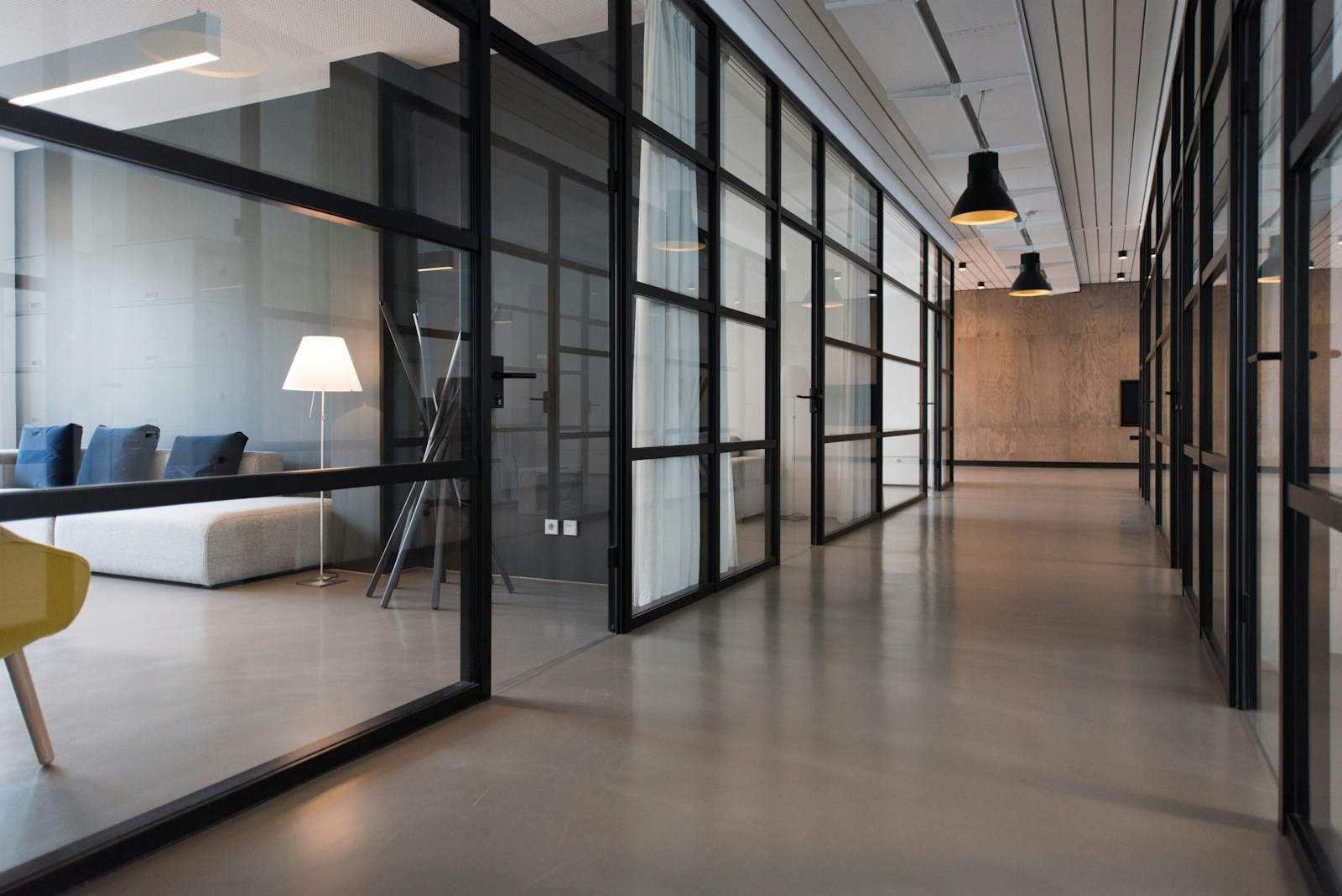 The Seal Vault — LegalSpark's counsel chamber with archival legal volumes and warm flax accent lighting